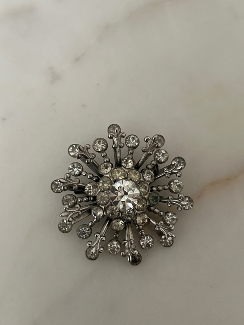 Coro Rhinestone Sunburst Brooch with silver Fleur-de- Lis accents
